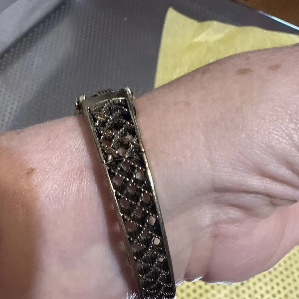 vintage-style floral women's cuff watch with a square face and black and silver-